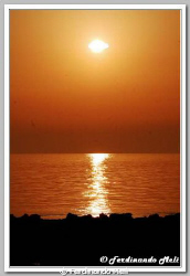 A beautiful sunset in the Mediterranean sea by Ferdinando Meli 